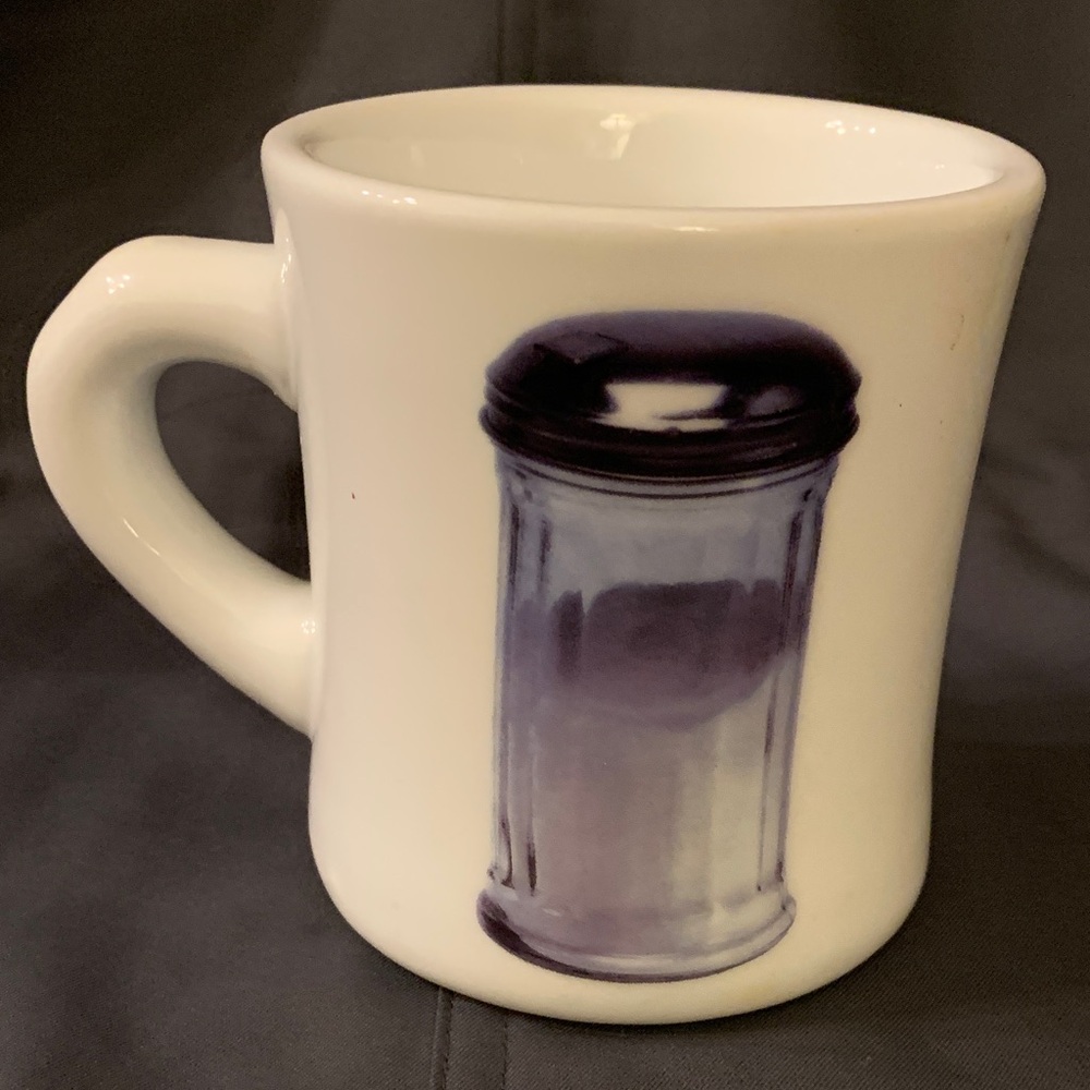 Diner style retro 50’s feeling. Mug has graphic image of vintage sugar shaker.